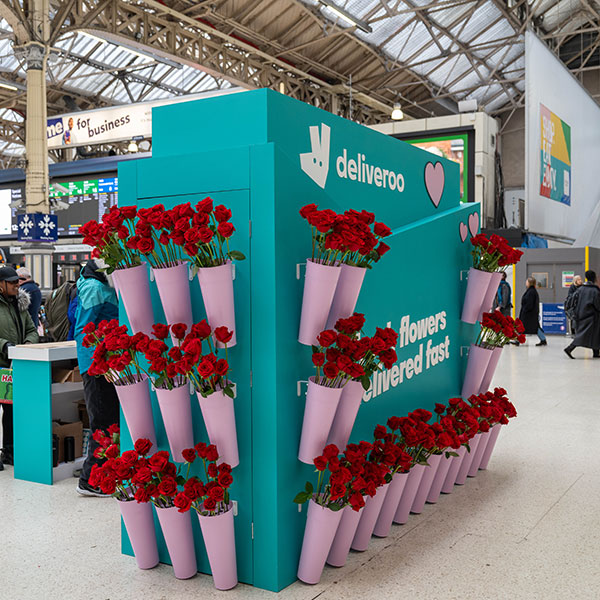 Brand ambassador handing out roses