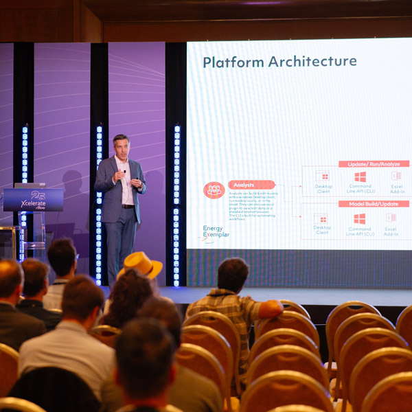 Conference speaker presenting on stage